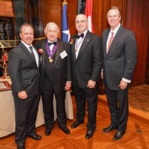 four men in suits standing